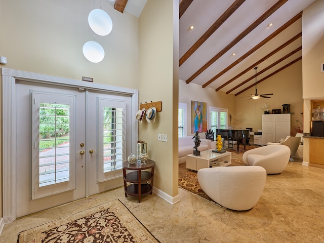 interior space featuring high vaulted ceiling, ceiling fan, french doors, and beamed ceiling