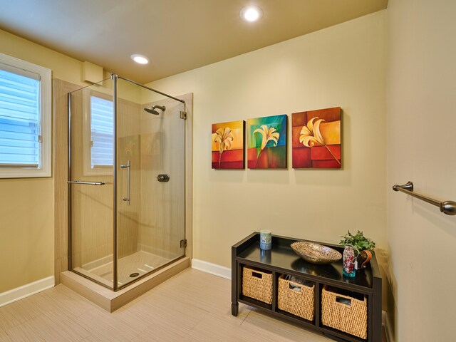 bathroom with a shower with shower door