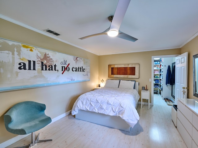 18238 128th Trl N, Jupiter, FL 33478 - bedroom featuring wood finished floors, ornamental molding, baseboards, and ceiling fan