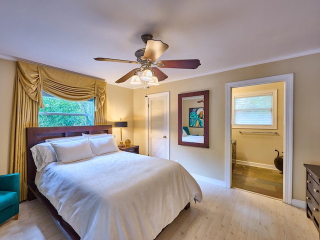 bedroom with a closet, ceiling fan, crown molding, and light hardwood / wood-style flooring