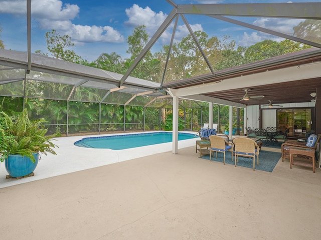 18238 128th Trl N, Jupiter, FL 33478 - outdoor pool featuring a patio area, a ceiling fan, outdoor dining space, and a lanai