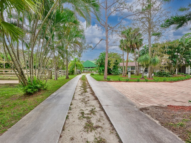 surrounding community featuring a yard