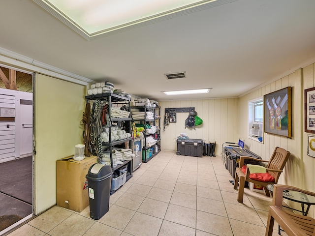18238 128th Trl N, Jupiter, FL 33478 - below grade area with tile patterned flooring, cooling unit, and wood walls