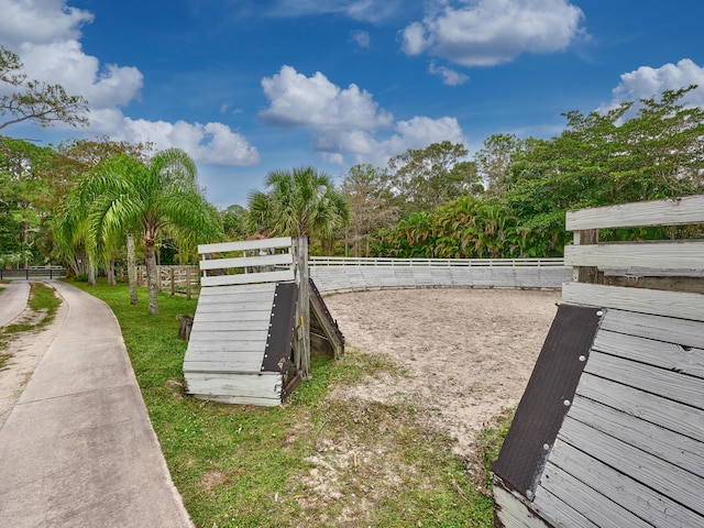 18238 128th Trl N, Jupiter, FL 33478 - view of home's community featuring fence, a dog friendly area, and view of scattered trees