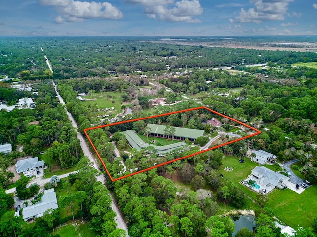 18238 128th Trl N, Jupiter, FL 33478 - aerial view of property and surrounding area with property parcel outlined and a heavily wooded area