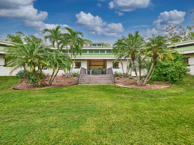 view of front of home with a porch and a front lawn