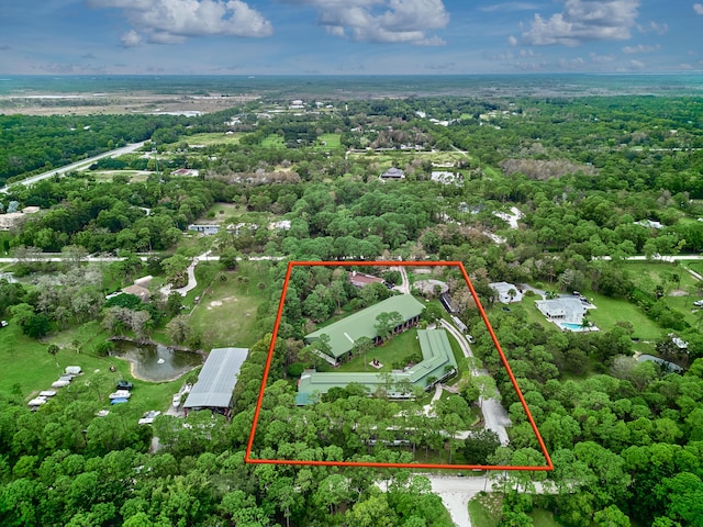 18238 128th Trl N, Jupiter, FL 33478 - aerial view of property and surrounding area featuring property parcel outlined and a forest