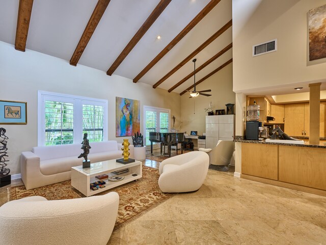 18238 128th Trl N, Jupiter, FL 33478 - living area with high vaulted ceiling, beam ceiling, ceiling fan, and baseboards