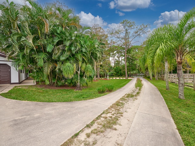 surrounding community featuring a lawn