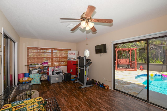 interior space with ceiling fan