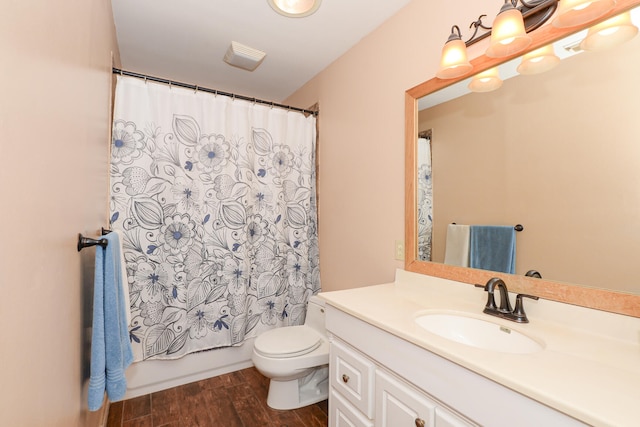 full bathroom with toilet, vanity, shower / bath combo with shower curtain, and hardwood / wood-style floors