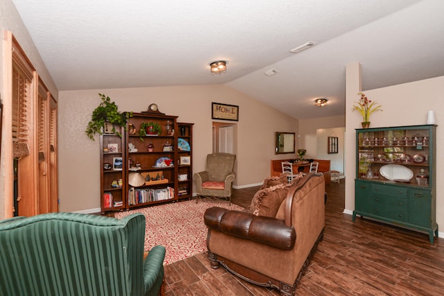 living room with vaulted ceiling and dark hardwood / wood-style floors