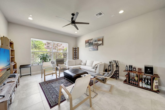 living room with light tile patterned flooring and ceiling fan