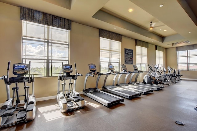 exercise room with a tray ceiling