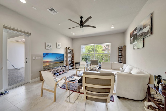 living room with ceiling fan and light tile patterned floors