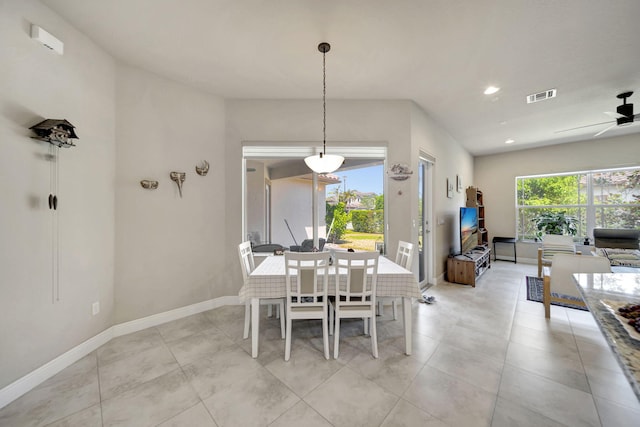 dining space featuring ceiling fan