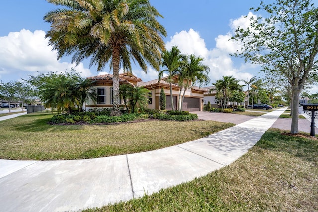 mediterranean / spanish-style house with a front lawn