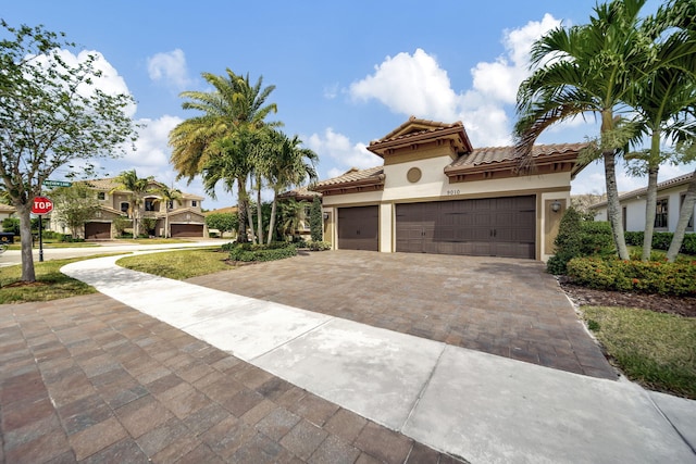 mediterranean / spanish-style home featuring a garage