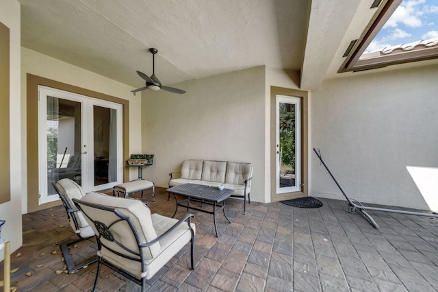 view of patio with french doors and ceiling fan