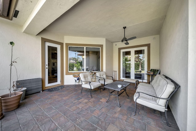 view of patio with french doors, ceiling fan, and an outdoor living space