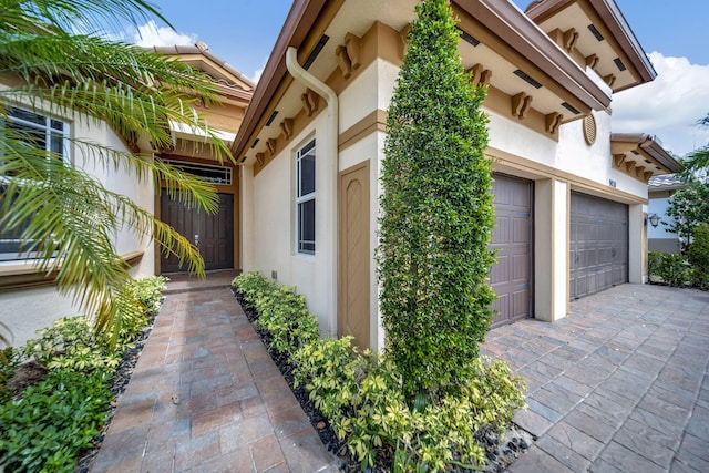 view of side of property with a garage