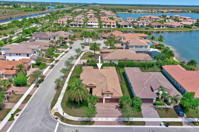 birds eye view of property featuring a water view