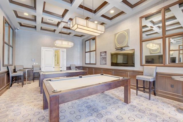 game room featuring pool table, a towering ceiling, coffered ceiling, ornamental molding, and beamed ceiling