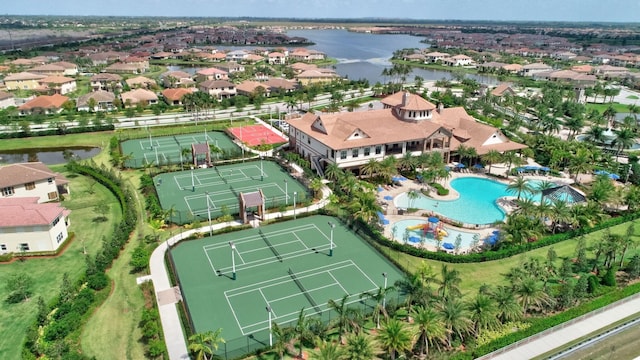 birds eye view of property with a water view