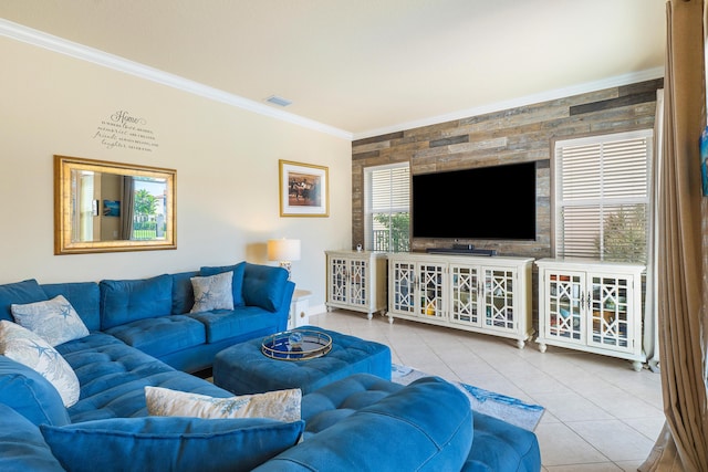 living room with light tile patterned floors and ornamental molding