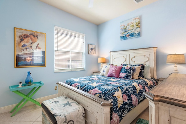 bedroom with ceiling fan and light tile patterned flooring