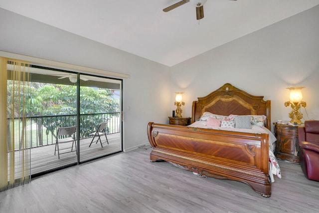 bedroom featuring ceiling fan, hardwood / wood-style floors, lofted ceiling, and access to outside