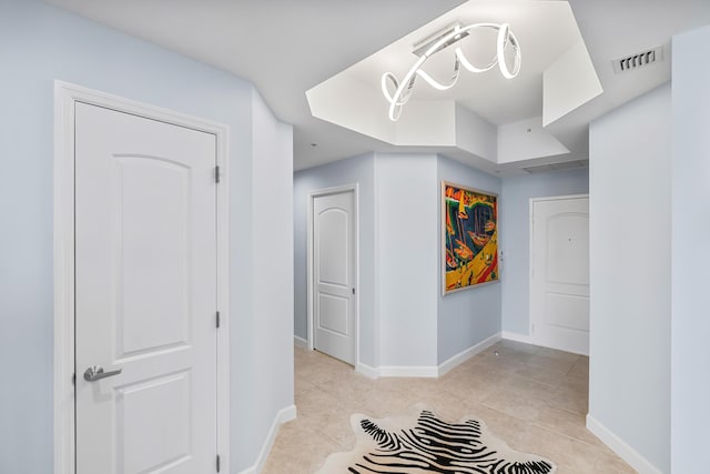 hallway with light tile patterned floors