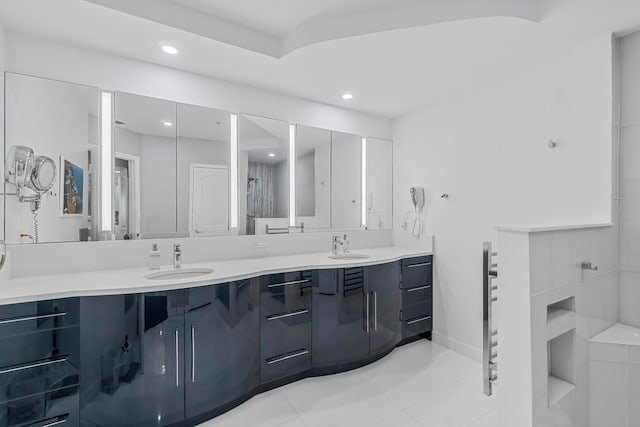 bathroom featuring tile patterned flooring and vanity