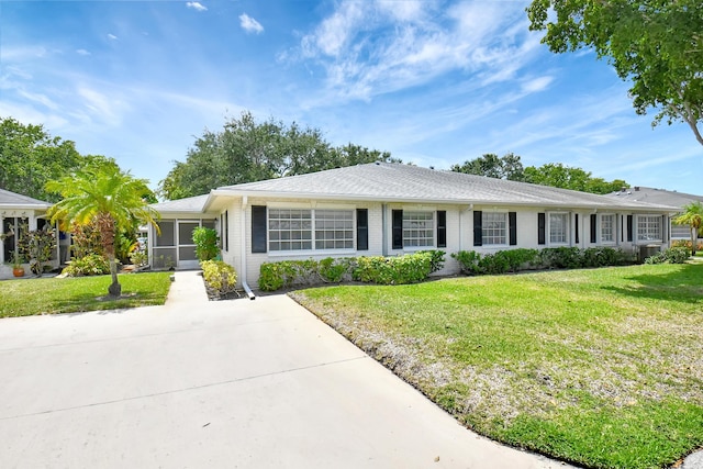 ranch-style home with a front yard