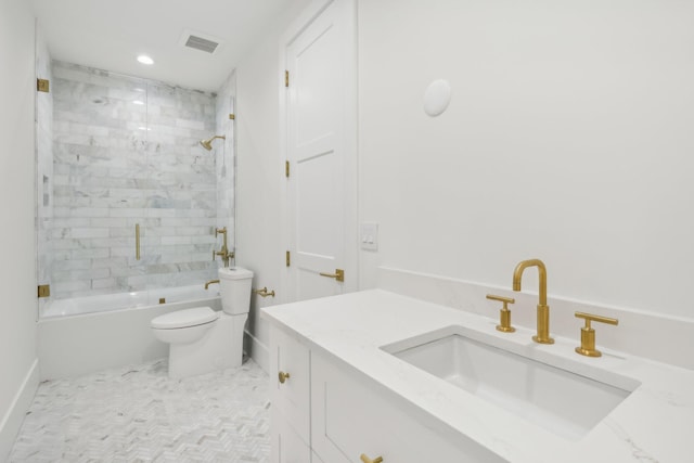 full bathroom with toilet, combined bath / shower with glass door, and vanity