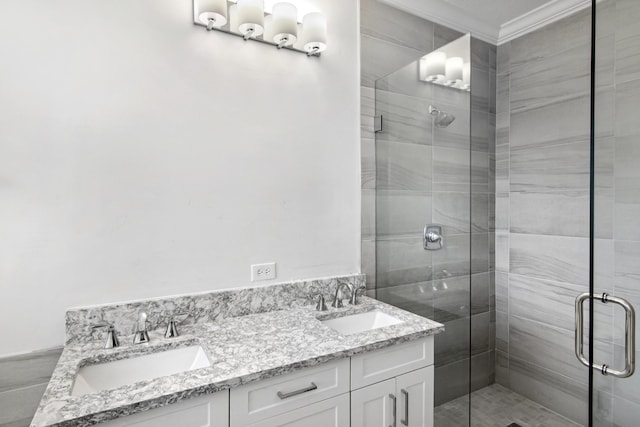 bathroom featuring vanity, an enclosed shower, and ornamental molding