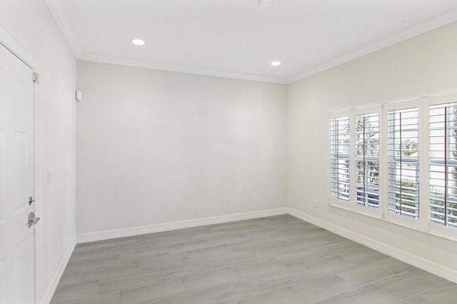 unfurnished room featuring crown molding