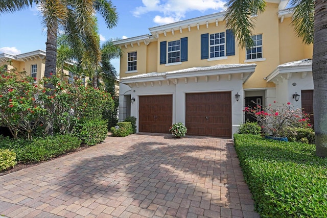 mediterranean / spanish-style home featuring a garage