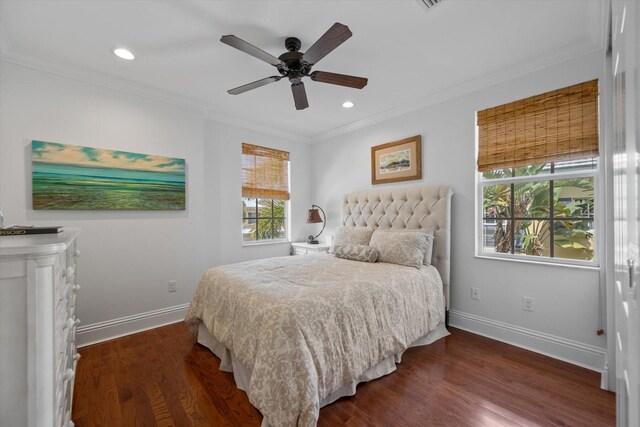 bedroom with ceiling fan, crown molding, and dark wood-type flooring