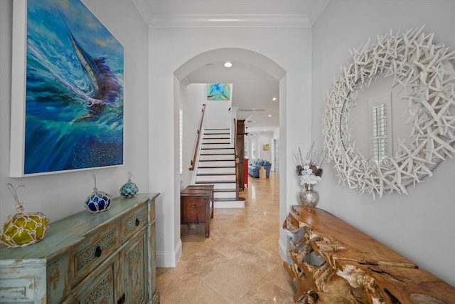 corridor featuring ornamental molding and light tile floors