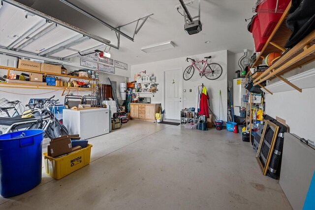 garage with water heater and a garage door opener