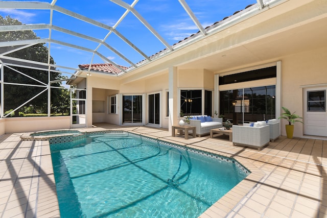 view of pool with a lanai, an in ground hot tub, an outdoor hangout area, and a patio area