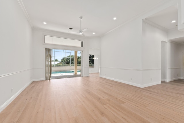 unfurnished room with crown molding, ceiling fan, and light wood-type flooring