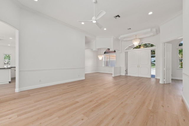 unfurnished living room featuring crown molding, light hardwood / wood-style flooring, and ceiling fan