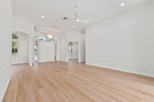 unfurnished living room featuring crown molding, ceiling fan, and light hardwood / wood-style floors