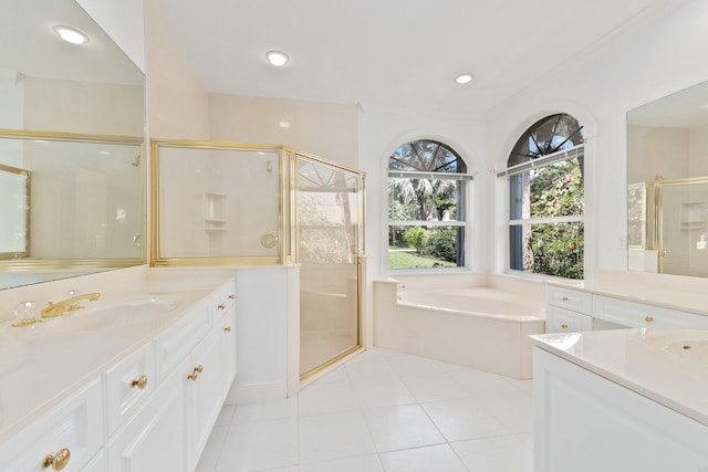 bathroom with vanity, tile patterned floors, and shower with separate bathtub