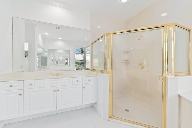 bathroom featuring lofted ceiling, vanity, tile patterned flooring, and a shower with shower door