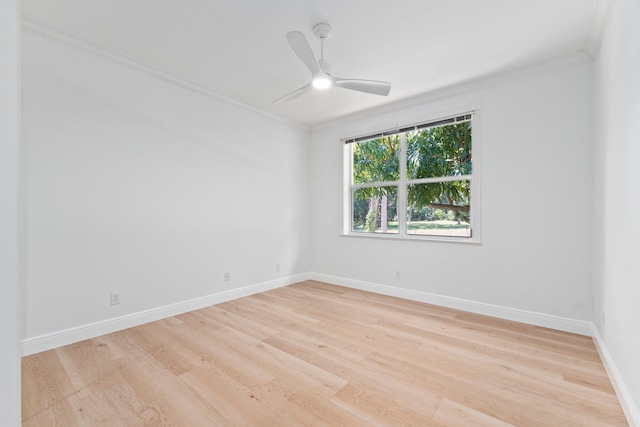 empty room with light hardwood / wood-style flooring, ceiling fan, and ornamental molding