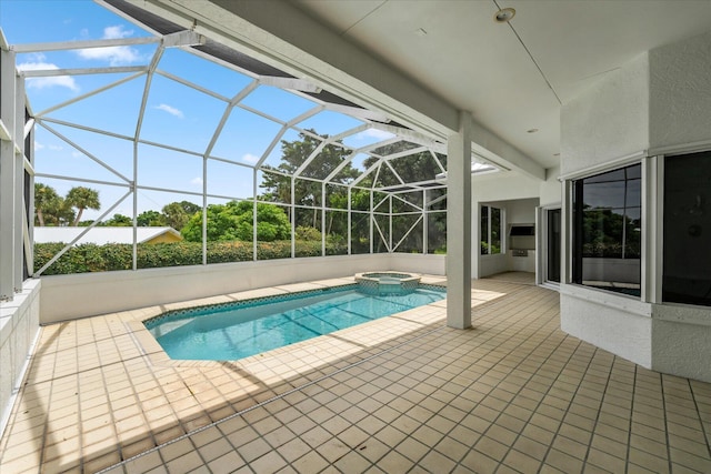 view of pool with a lanai, a patio, and an in ground hot tub