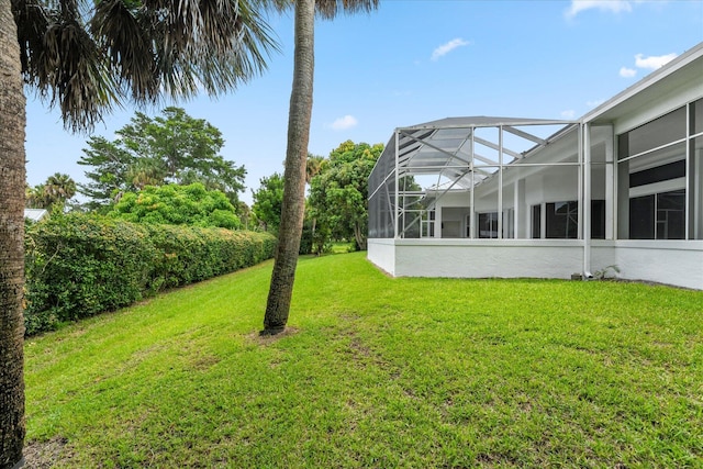 view of yard with a lanai